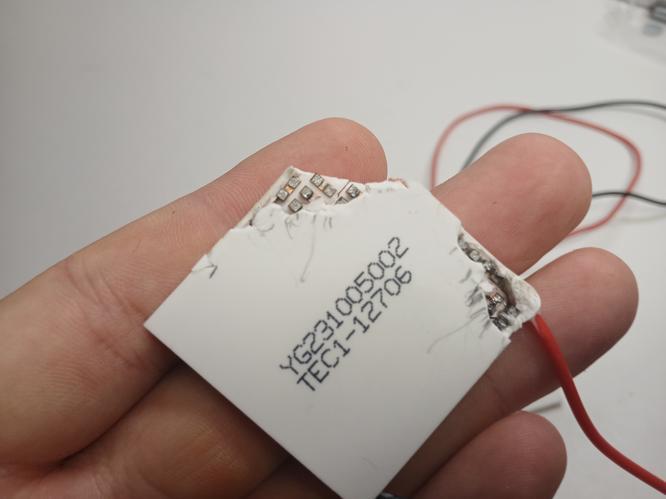 Peltier units from a laser handpiece examined under a microscope Close-up of diode laser handpiece Peltier components